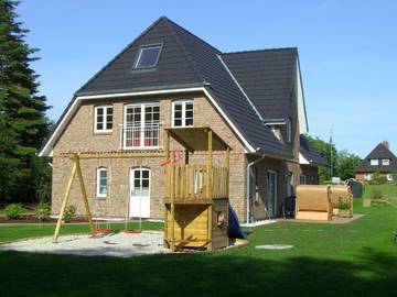 Ferienwohnung für 4 Personen, mit Garten und Ausblick sowie Sauna, mit Haustier in Süddorf