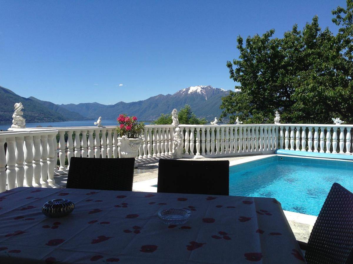 Ferienhaus Patrizia with a fantastic view of Lake Maggiore and the pool in Gordola, Tessiner Alpen