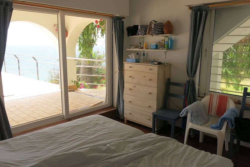An air-conditioned villa, set in a large garden, on the first line of the beach in Los Caños de Meca, Barbate
