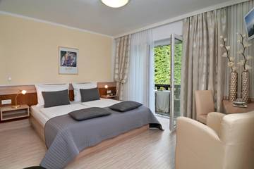 Ferienwohnung für 2 Personen, mit Balkon und Garten sowie Seeblick am Faaker See