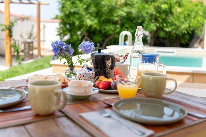 Appartamento per 2 persone, con giardino e piscina in Cabras