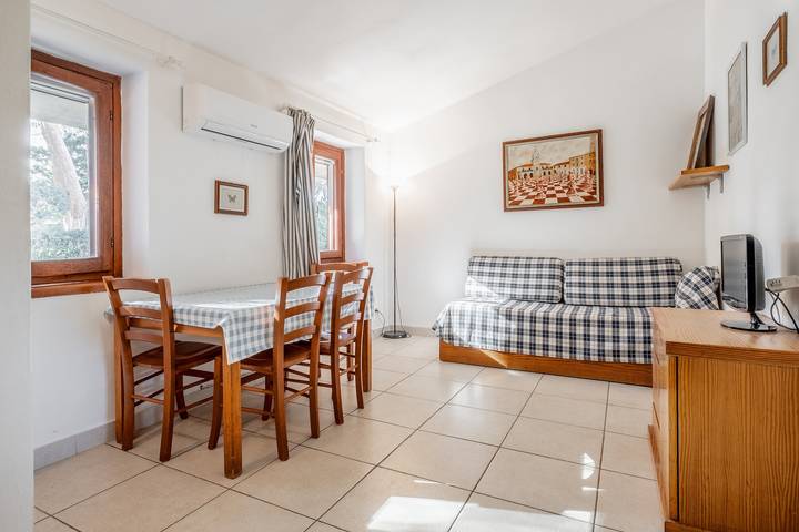 Geheel appartement, Appartement 'La Capannuccia A' met gedeelde tuin, wifi en airconditioning in Al Cartello, Orbetello