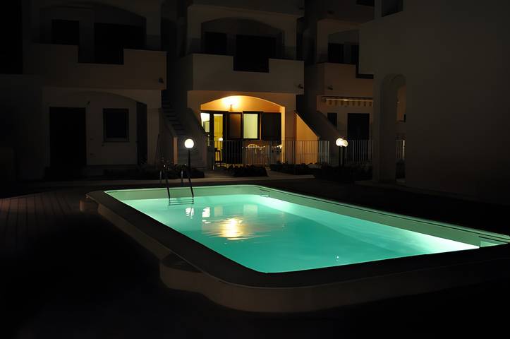 Entire apartment, Apartment 'La Rosa Dei Venti' with Shared Pool and Air Conditioning in Viddalba, Sassari Province