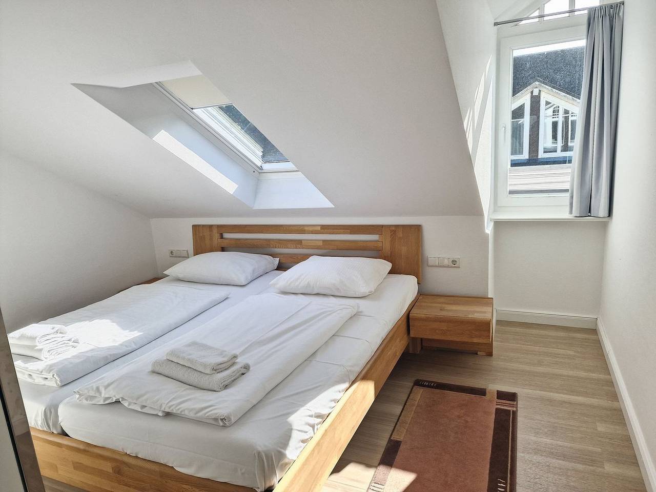 Geheel appartement, Komfortplus Ferienwohnung mit 2 Schlafzimmern und Balkon im Dachgeschoss in Ostseebad Binz, Prora