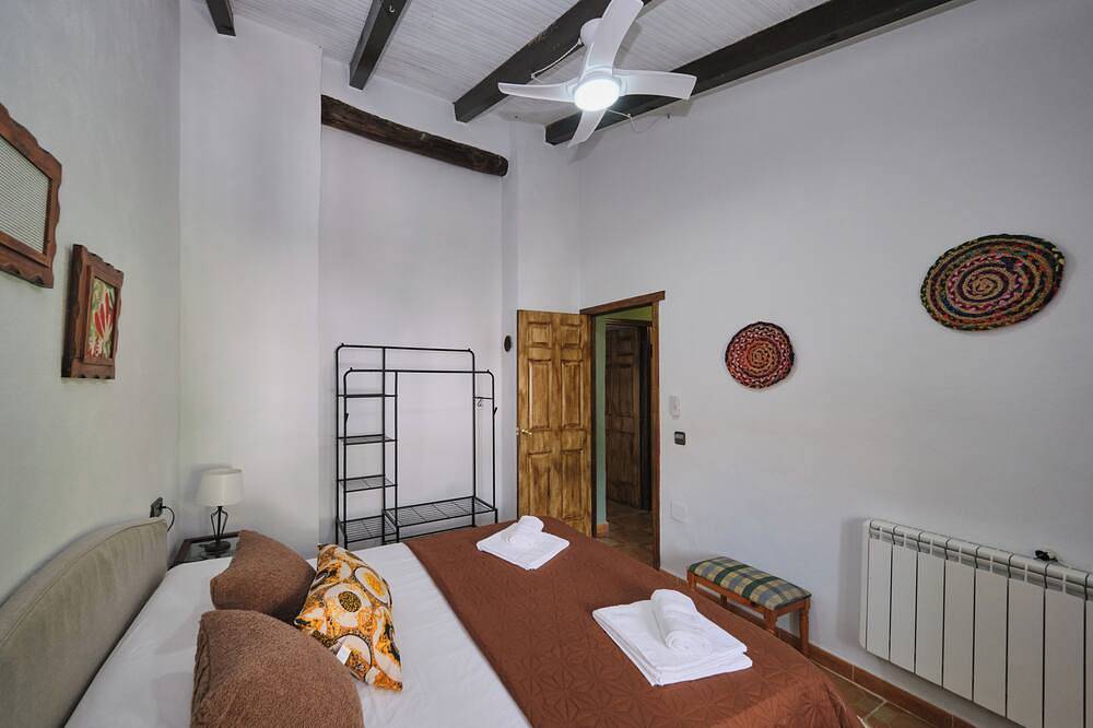 Luxury bedroom at Los Retamales with a queen-size bed, Casa Mathilda in Arenas del Rey, Cordillera Penibética