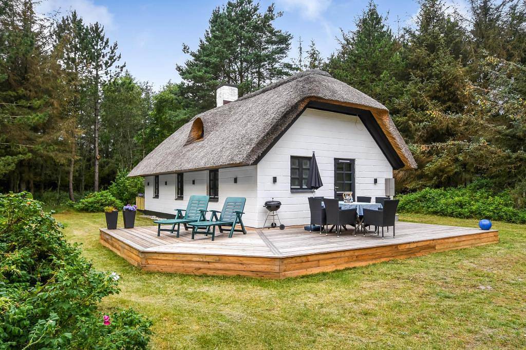 Modernised holiday home with woodburning stove, whirlpool and great wooden terrace in Vester Husby, Husby