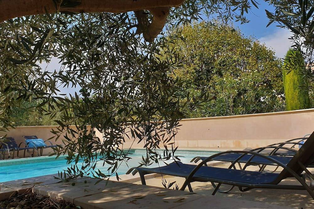 In Provence, lovely renovated farmhouse with swimming pool, wooded and flowered grounds in Bollène, Vaucluse