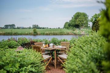 Ferienwohnung für 4 Personen, mit Garten und Ausblick sowie Seeblick und Sauna in Neuwesteel