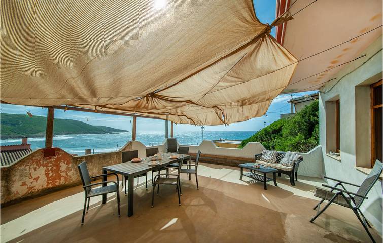 Apartamento vacacional entero, Acogedor refugio junto a la playa: WiFi, AC, Cocina -600m a la Playa in Porto Palma, Arbus (Municipio)