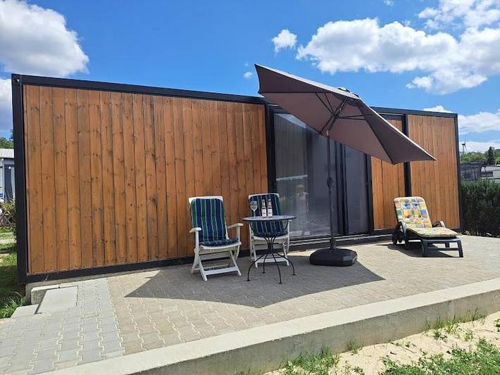Ferienhaus für 2 Personen, mit Terrasse und Garten sowie Kinderpool und Seeblick