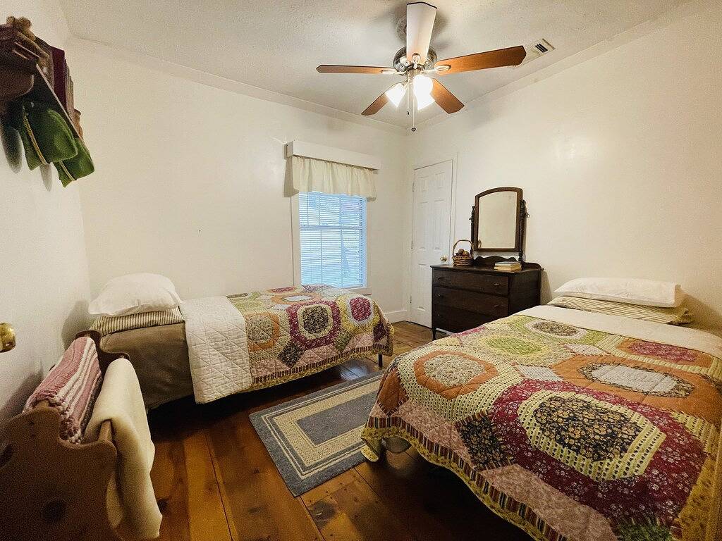 Downtown by Chattahoochee River, sit on front porch as horse and buggy stroll by in Helen, Chattahoochee National Forest