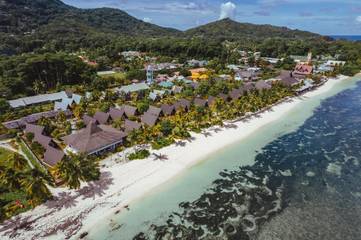 Cottage pour 2 personnes, avec bassin pour enfant ainsi que piscine et jardin dans La Digue