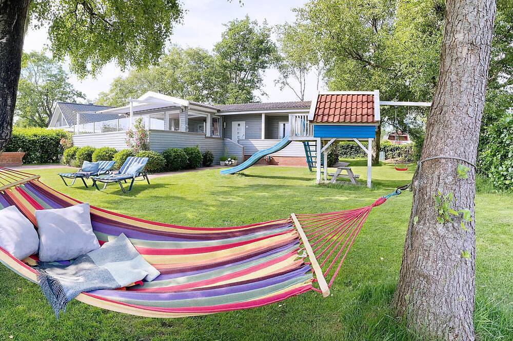 5 Sterne Ferienhaus mit freiem Seeblick, direkter Wasserlage und eigenem Steg. — Bild 2