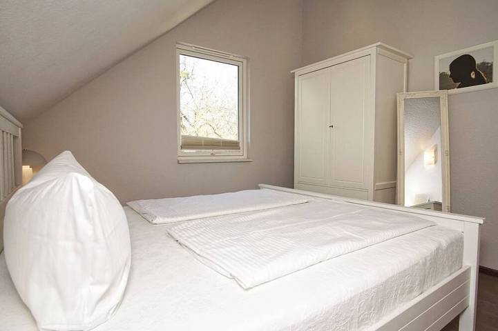 Haus Sternschnuppe—a cozy house with a fireplace, sauna, garden, and patio— in Wiek, Ruegen