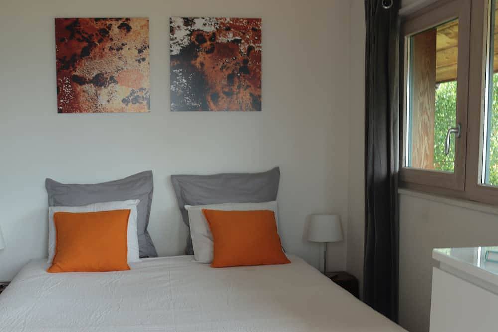 Timber-frame house between lake and mountains in Talloires-Montmin, Annecy region