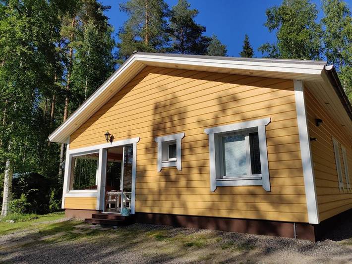 Ferienhaus für 7 Personen, mit Terrasse und Garten sowie Sauna und Seeblick
