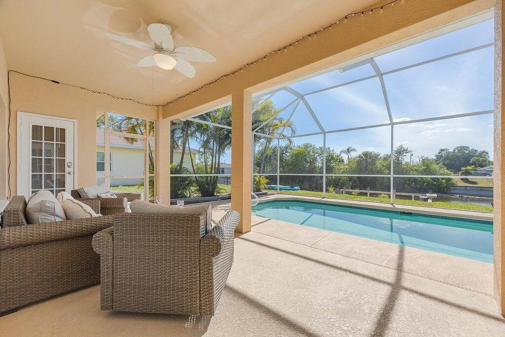 Relax along the canal, kayaks, Sunsets, Heated Pool - Villa Relax & Enjoy - Roelens Vacations in Cape Coral, Southwest Florida