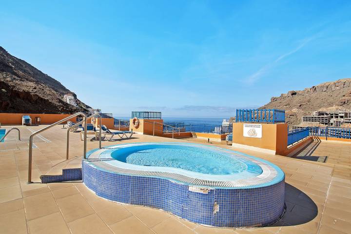 Ganze Wohnung, Ferienwohnung 'Paraíso Taurito' mit Meerblick, Terrasse, Gemeinschaftspool & WLAN in Playa Taurito, Mogán