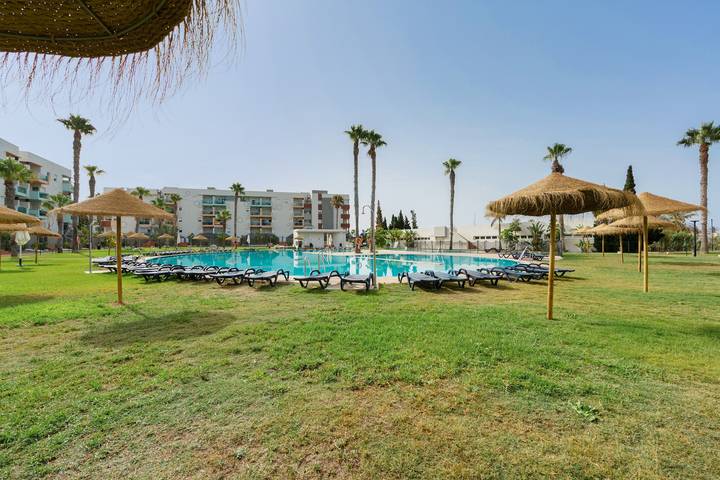 Entire apartment, Premium family apartment in Almerimar with garden and pool views in Almerimar, El Ejido