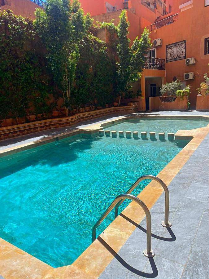 Appartement de vacances pour 2 personnes, avec balcon ainsi que bassin pour enfant et piscine à Marrakech