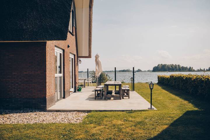 Ferienhaus für 8 Personen, mit Balkon und Balkon/Terrasse sowie Terrasse und Garten