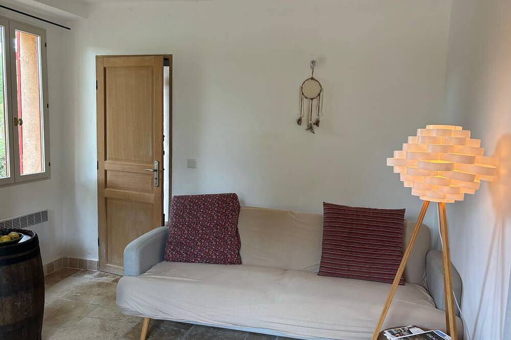Provençal farm among olive trees; view of the hill from a large shaded terrace in Villecroze, Draguignan Region
