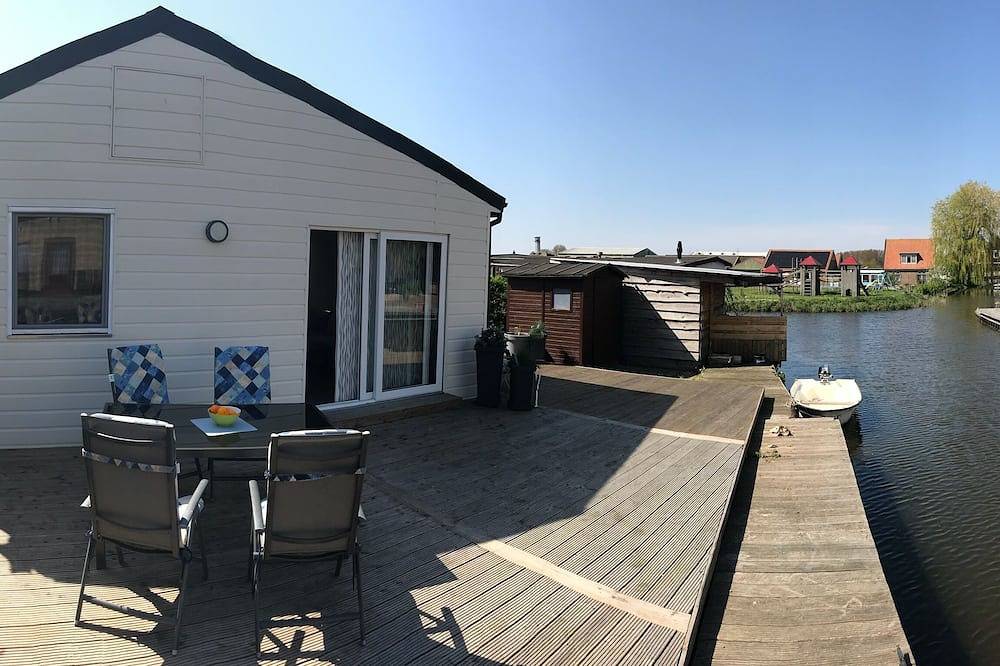 Modernes, helles Ferienhaus mit viel Sonne und eigenem Bootssteg in Ijsselmeer