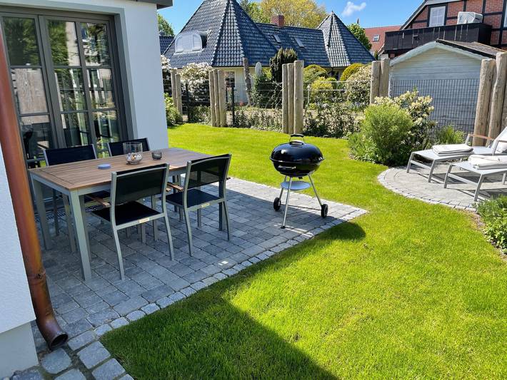 Appartement entier, Appartement 'Kleine Mügge' avec terrasse privée, jardin privé et Wi-Fi in Strand Zingst, Zingst