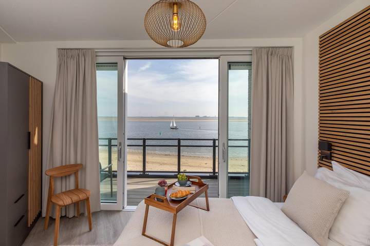 Ferienhaus mit meerblick für 4 Personen, mit Balkon und Balkon/Terrasse sowie Terrasse und Seeblick in Zeeland - 4
