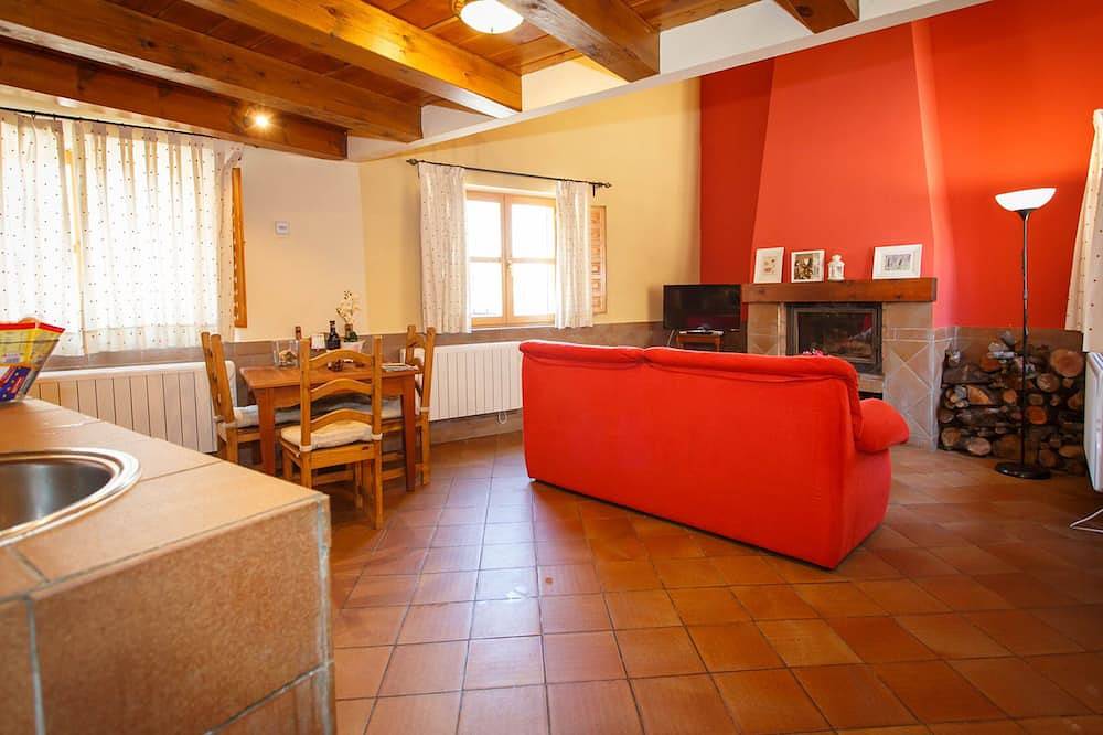 La Fragua is a beautiful little house with a gable roof built in stone and wood in Piñuécar, Madrid Province