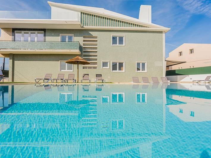Casa de férias para 20 pessoas, com varanda e jardim e ainda piscina em Charneca de Caparica e Sobreda