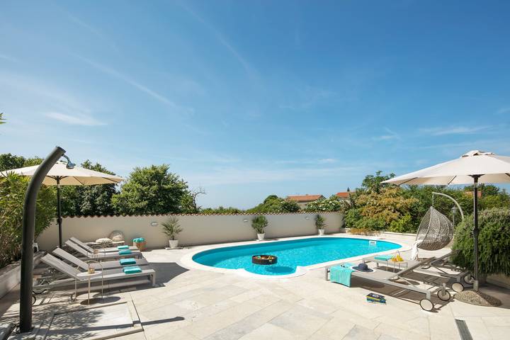 Ferienhaus für 12 Personen, mit Balkon und Balkon/Terrasse sowie Terrasse und Sauna