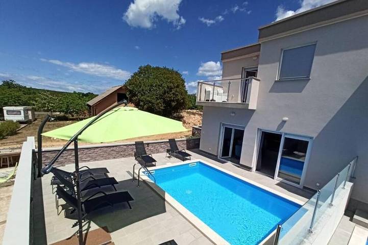 Ferienhaus für 7 Personen, mit Balkon und Garten