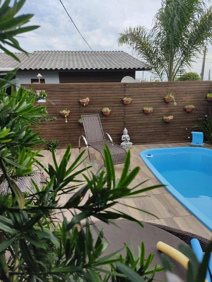 Casas e apartamentos de temporada para 4 pessoas, com vista e piscina e ainda balcão and jardim em Passo de Torres