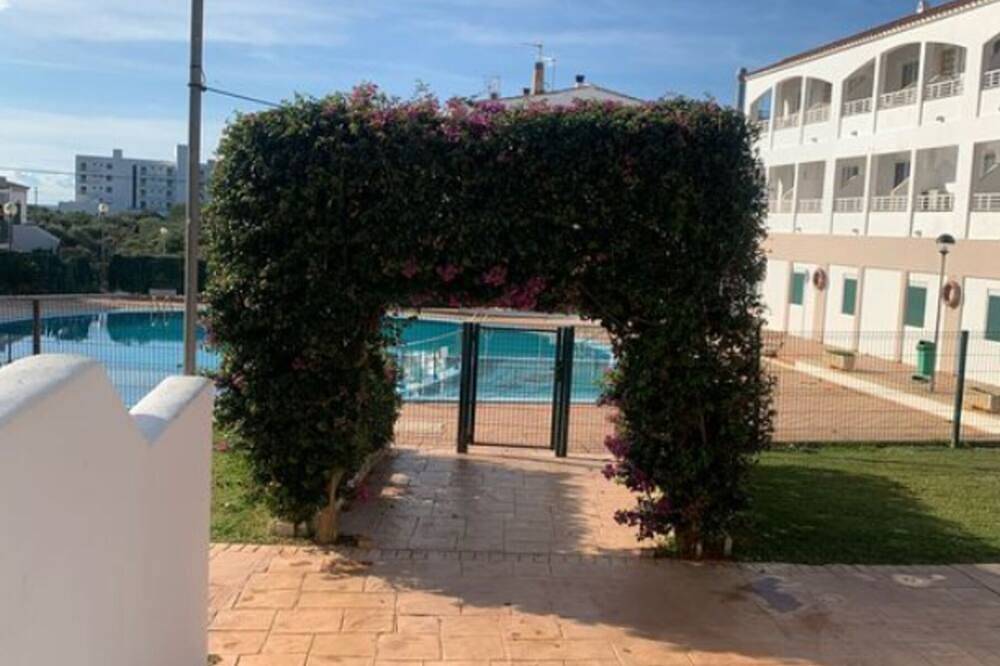 Entire apartment, Ground floor apartment, with garden and direct access to pool. A. A. Free Wifi in Cala Blanes, Ciutadella