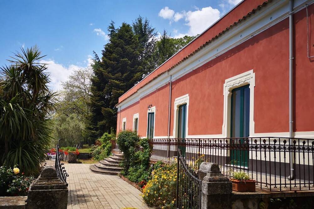 Typical charming villa surrounded by nature and old trees in Milo, Mount Etna