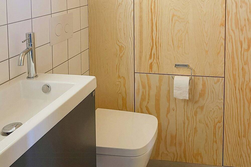 Modernes Holzhaus zwischen Apfelbäumen mit Meerblick in Kivik, Österlen