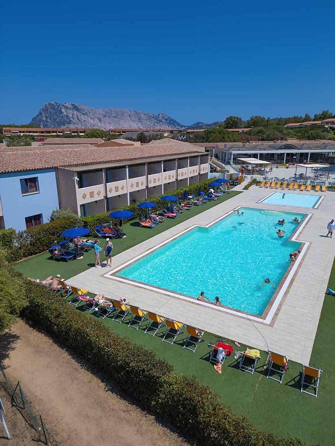 Appartamento per 2 persone, con giardino e piscina per bambini nonché piscina in Capo Coda Cavallo