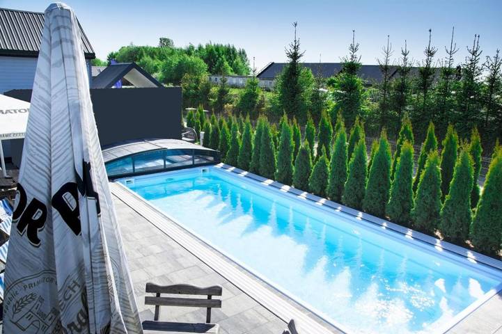 Domek letniskowy dla 9 osób, z Balkon i Taras oraz Jacuzzi i Ogród w Mielno