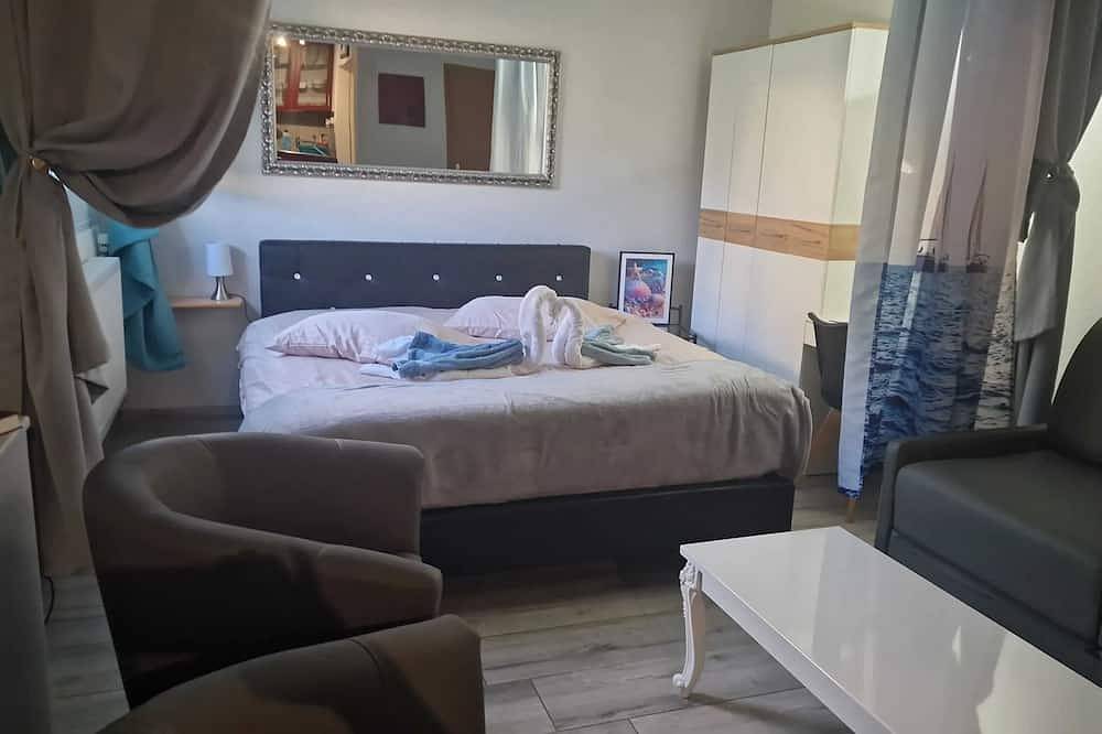 Entire apartment, Homerez - Comfortable studio in Bevaix with mountain view - 30 m² + Spa in La Grande-Béroche, Three-Lakes