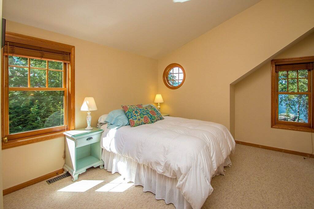 Waterfront home in Moultonborough with sandy beach and dock in Moultonborough, Lake Winnipesaukee