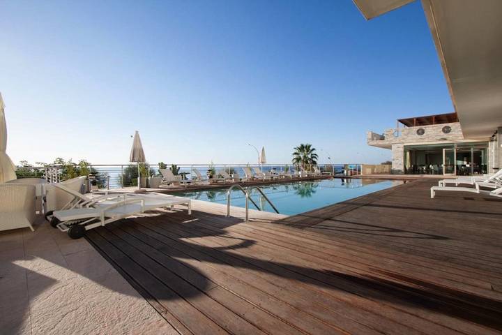 Appartamento per 4 persone, con Balcone e Idromassaggio nonché Piscina e Sauna a Roccalumera