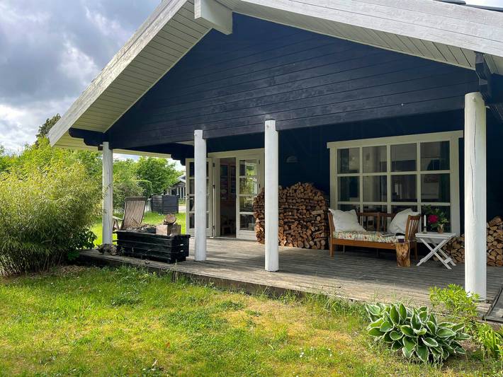 Summer house with path to pier by fjord in Vellerup, Skibby