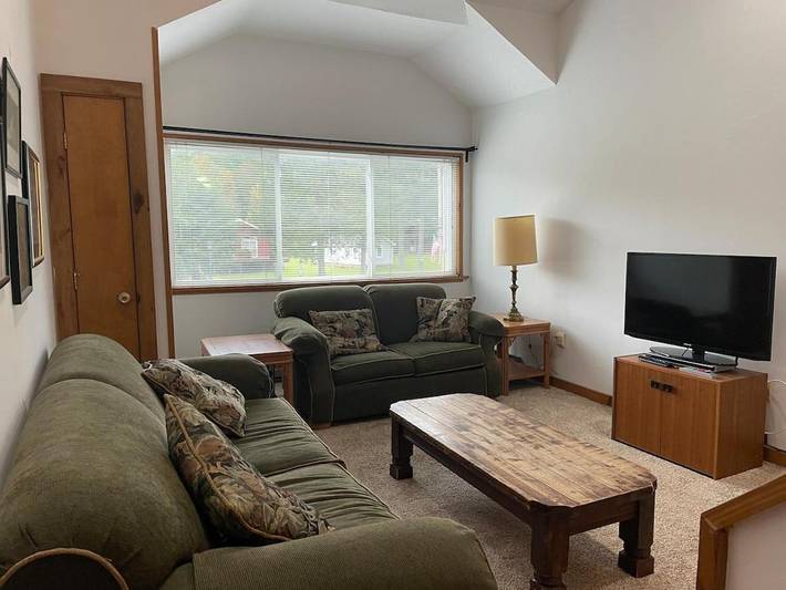 Appartement de vacances pour 2 personnes, avec jardin ainsi que vue et vue sur le lac