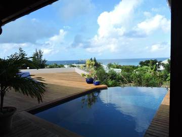 Cottage pour 9 personnes, avec vue ainsi que jardin et piscine, adapté aux familles dans Friars Bay Saint Martin