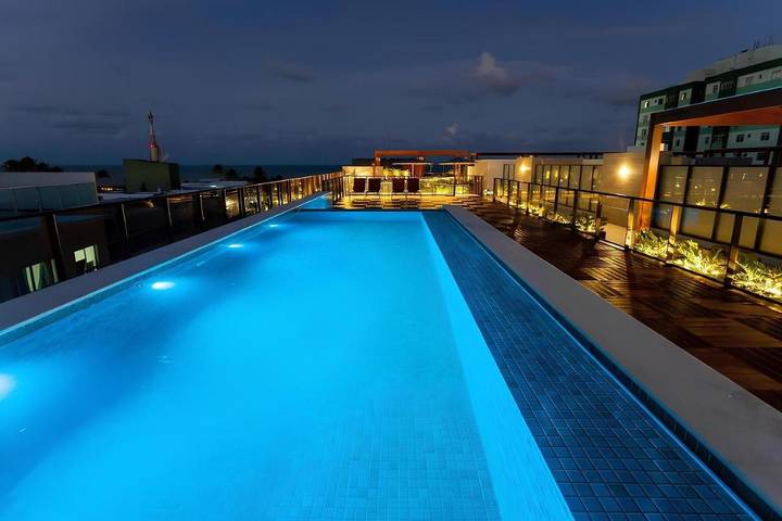 Casas e apartamentos de temporada para 4 pessoas, com piscina infantil e vista e ainda jardim and piscina, com animais de estimação em Tambaú