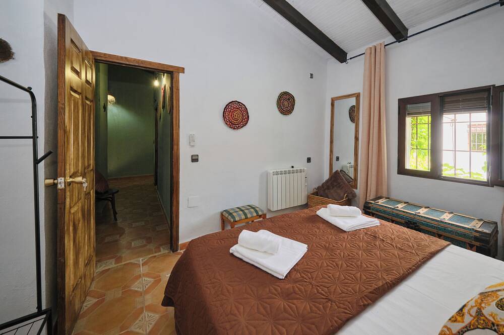 Luxury bedroom at Los Retamales with a queen-size bed, Casa Mathilda in Arenas del Rey, Cordillera Penibética