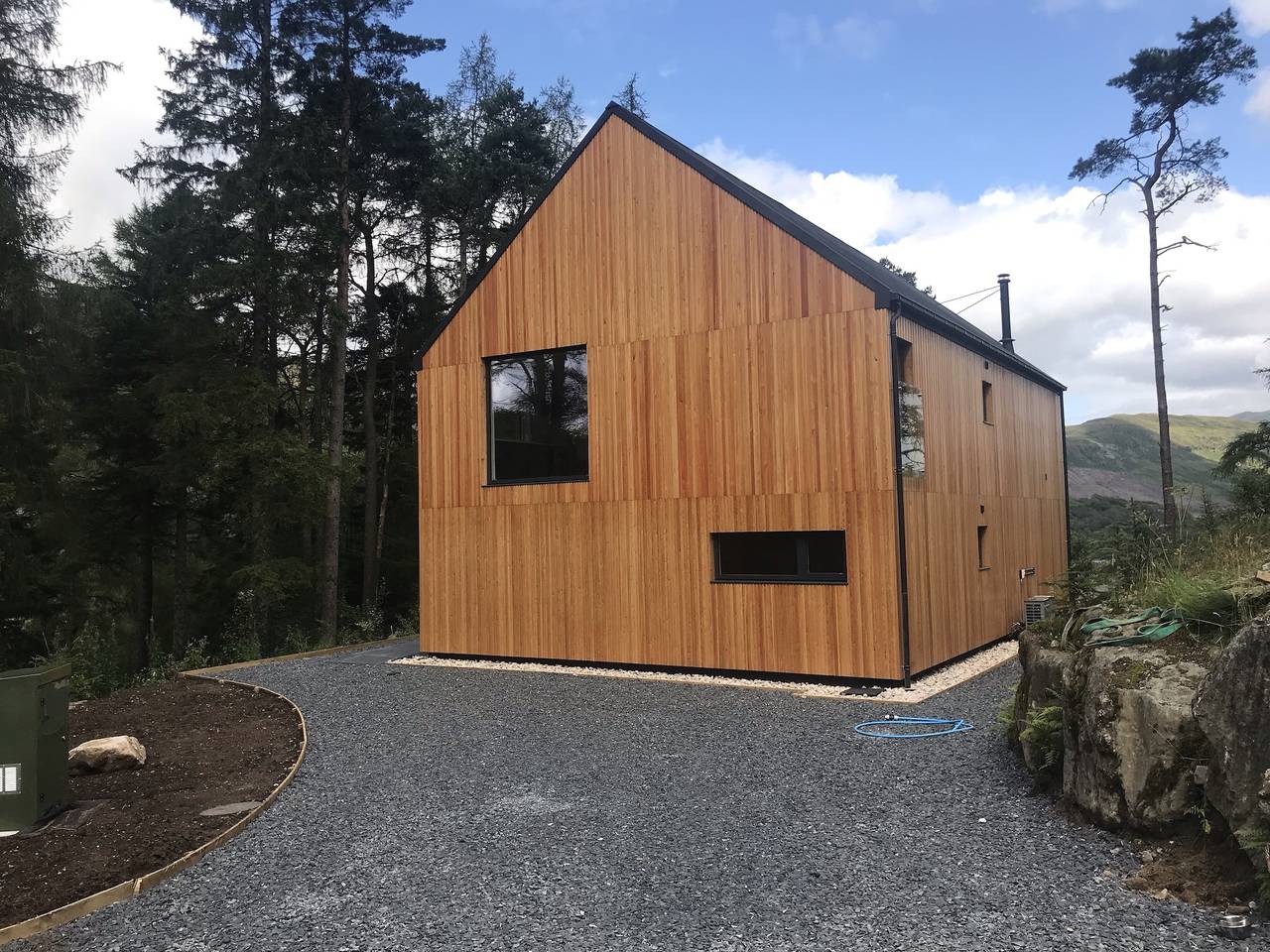 An Caisteal Lodge with cascading waterfall view in Stirling region