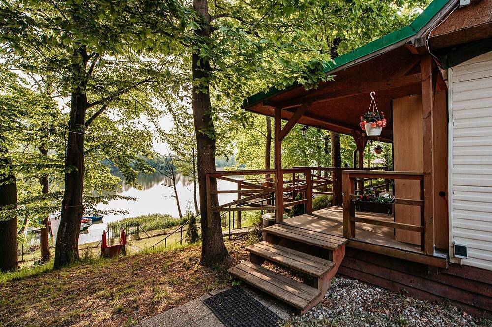 Domek uroczo położony we wsi Drynki, przy jeziorze Pozorty. Osada 4-ech domków in Seenplatte von Ilawa