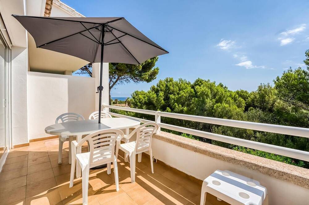 Apartamento entero, Apartment \"Orchidée\"- sea view, swimming pool, air conditioning, terrace. in Arenal d'en Castell, Es Mercadal